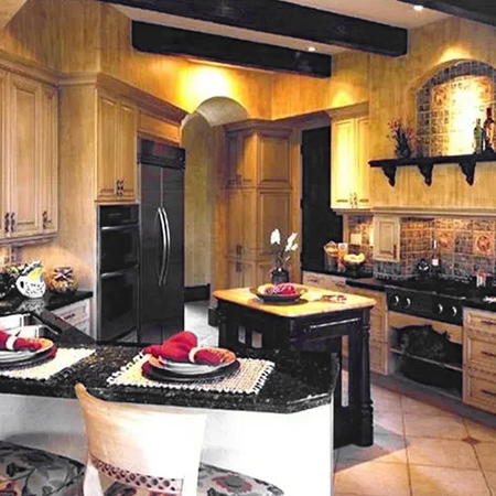 Tuscan-style kitchen with warm wood cabinets, black granite counters and a tiled range backsplash