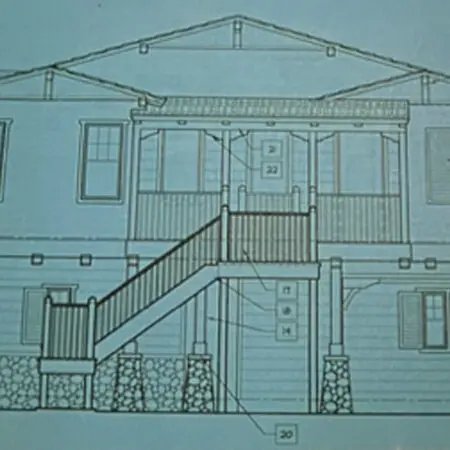 Architectural drawing of a two-story Craftsman home with an exterior staircase