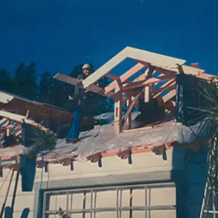 Worker framing new rafters for a second-story addition